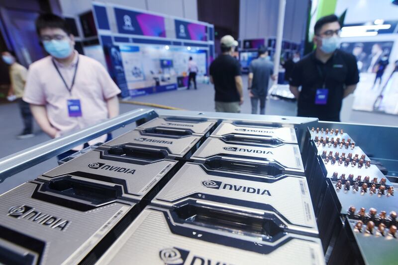 Visitors view the world's first AI general infrastructure system built on Nvidia A100 at the Global AI Technology Conference 2021 in China. The company is withdrawing from a deal to buy Softbank's Arm. Getty Images