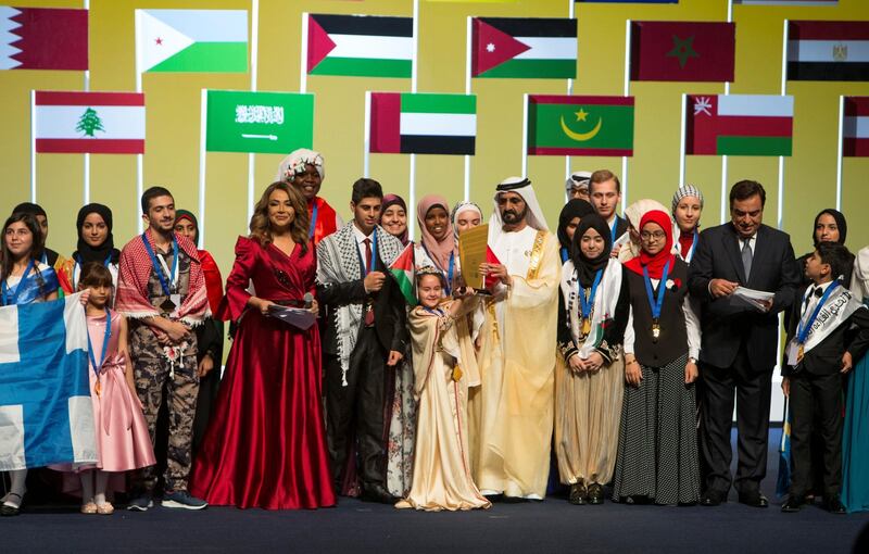 DUBAI, UNITED ARAB EMIRATES, 30 OCTOBER 2018 - HH Sheikh Mohammed bin Rashid Al Maktoum, Vice President of UAE and Ruler of Dubai with the grand winner Mariam Amjoun of Morocco at the Arab Reading closing at Dubai Opera, Sheikh Mohammed Bin Rashid Boulevard.  Leslie Pableo for The National