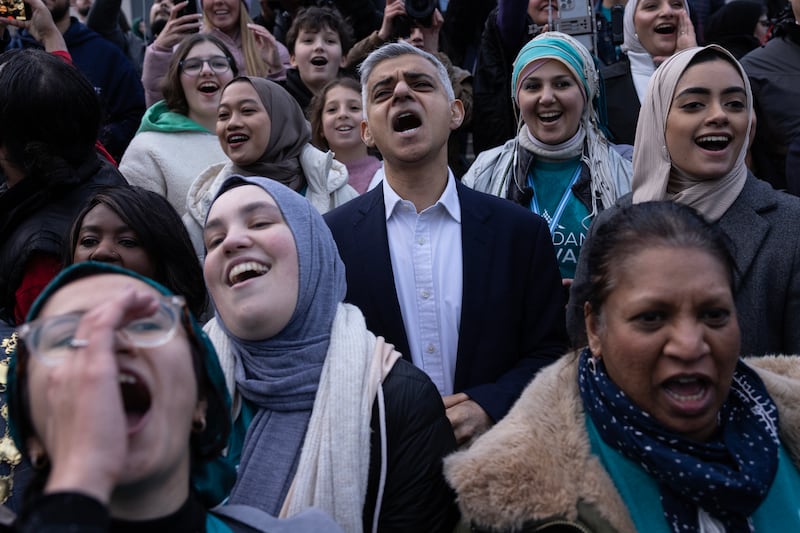 Muslims including London Mayor Sadiq Khan, centre, and members of other faiths gather in Trafalgar Square for an open iftar event on April 20. Mr Khan will stand for re-election next year. Getty