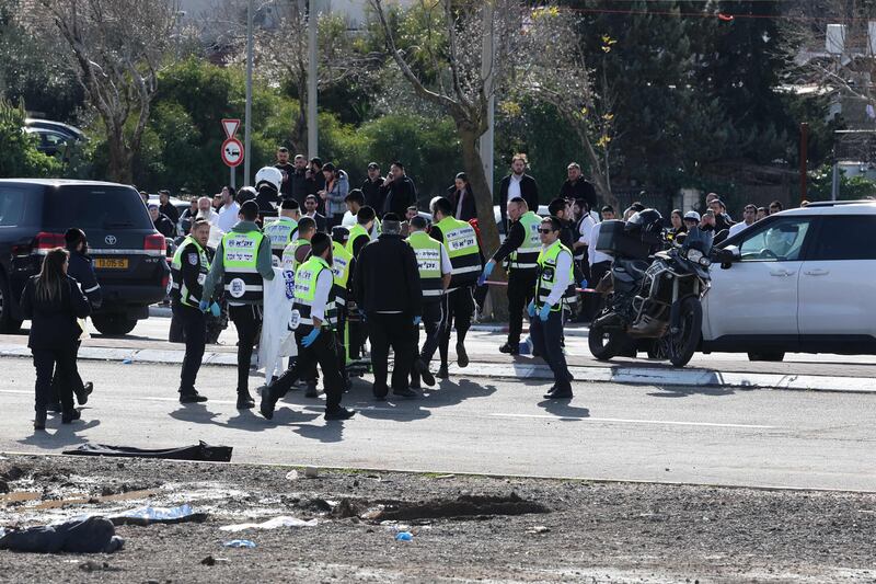 Responders gather at the site of the suspected attack. AFP