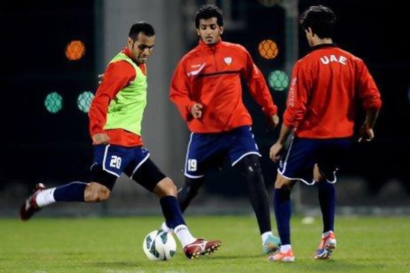 Saeed Al Kathiri, left, and Abdulaziz Sanqour, centre, take part in a training session ahead of today's match with Bahrain. Courtesy of the UAE FA