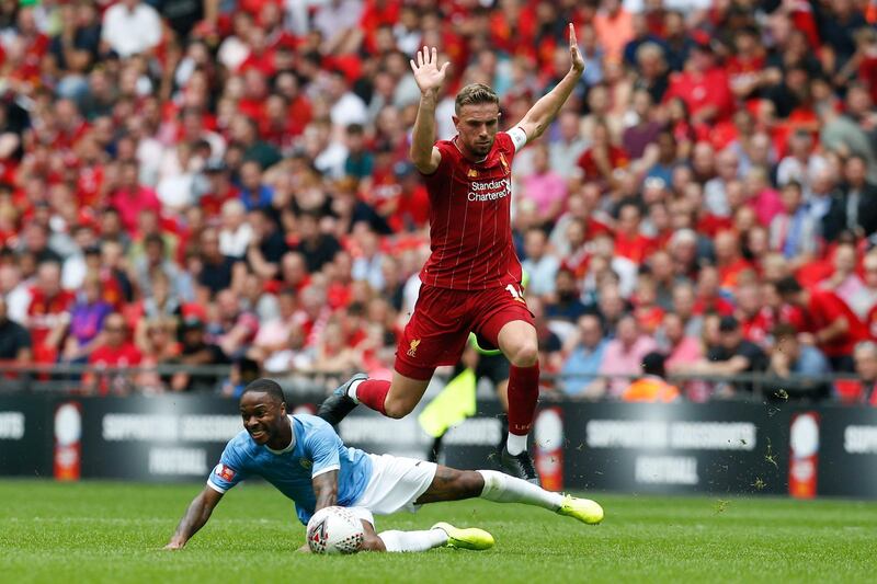 Manchester City's English midfielder Raheem Sterling (L) challenges Liverpool's English midfielder Jordan Henderson (R) during the English FA Community Shield football match between Manchester City and Liverpool at Wembley Stadium in north London on August 4, 2019.  - NOT FOR MARKETING OR ADVERTISING USE / RESTRICTED TO EDITORIAL USE
 / AFP / Ian KINGTON / NOT FOR MARKETING OR ADVERTISING USE / RESTRICTED TO EDITORIAL USE
