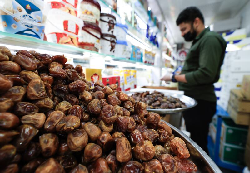 Residents shop during Ramadan at the Abu Dhabi Dates Market. All photos: Victor Besa / The National