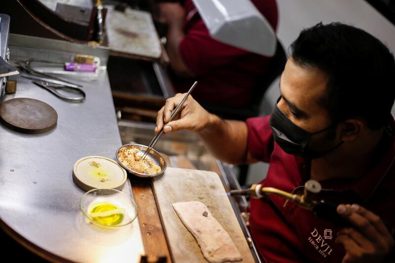 A gold craftsman at work at jewellery manufacturer and retailer Devji, in Hidd, Bahrain. Reuters