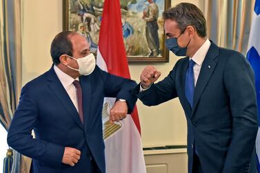Egyptian President Abdel Fattah El Sisi shares an elbow bump with Greek Prime Minister Kyriakos Mitsotakis as they meet at the presidential palace in Nicosia, Cyprus. EPA