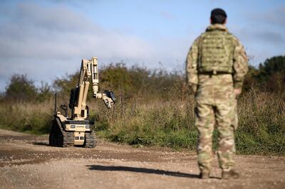 SALISBURY, ENGLAND - OCTOBER 15: A member of the Explosive Ordnance Disposal (EOD) search team looks on as a Harris T7 multi-mission robotic system is deployed during their Mission Rehearsal Exercise ahead of deployment to Mali, on the Ministry of Defence training area on Salisbury Plain, on October 15, 2020 in Salisbury, England. Later this year, 300 military personnel will join the UN in Mali on a peacekeeping mission and help counter instability following a coup which ousted President KevØta in August. The United Nations Multidimensional Integrated Stabilization Mission in Mali (MINUSMA) was formed in response to the seizing of territory by militant Islamists following a coup in 2012. The crisis in Mali has thrust 12.9 million into a precarious security situation, according to a UN estimate, with 6.8 million in need of humanitarian assistance. (Photo by Leon Neal/Getty Images)