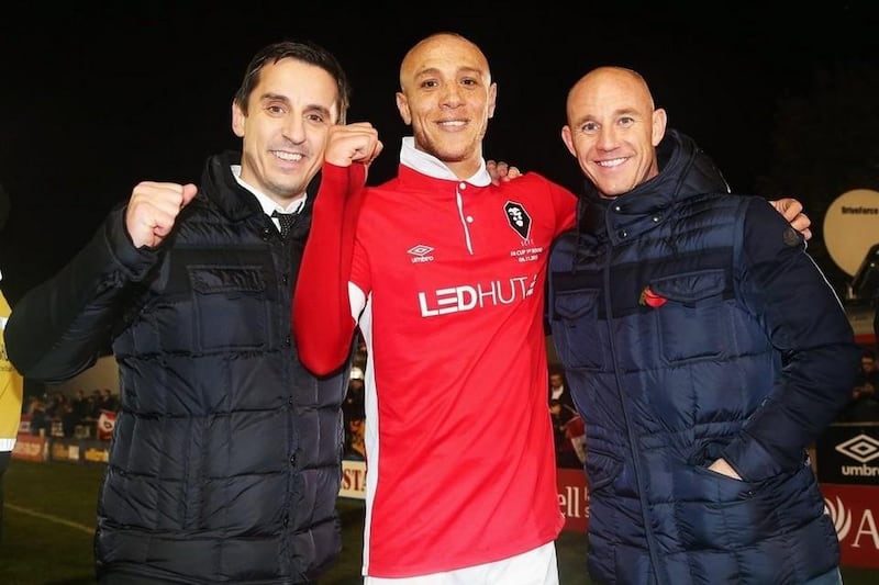 Joint Salford City owners Gary Neville and Nicky Butt celebrate victory with goalscorer Richie Allen night in their FA Cup win last month. Chris Brunskill / Getty Images / November 6, 2015