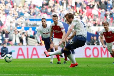 Tottenham's Harry Kane scores from the penalty spot against Arsenal at Wembley. Reuters