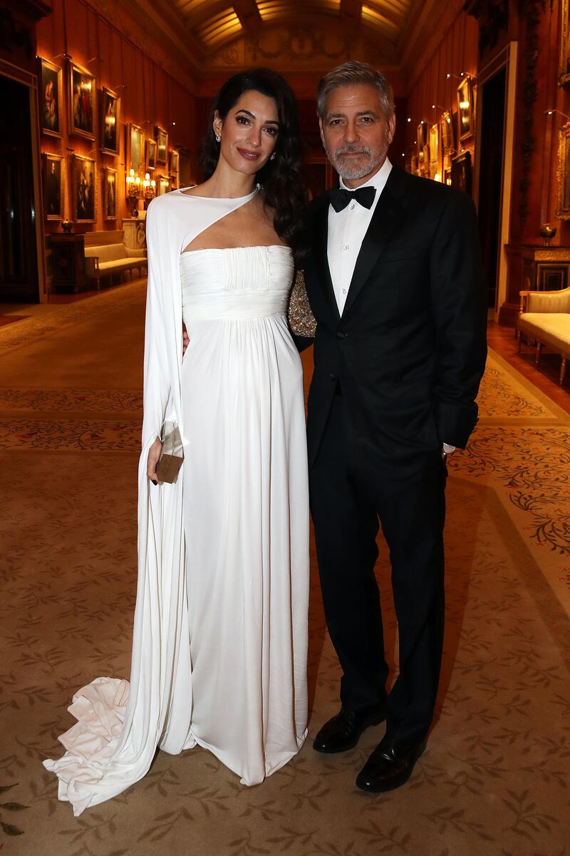 Amal Clooney and George Clooney attend a dinner to celebrate The Prince's Trust, hosted by Prince Charles at Buckingham Palace on March 12, 2019 in London, England. Getty Images