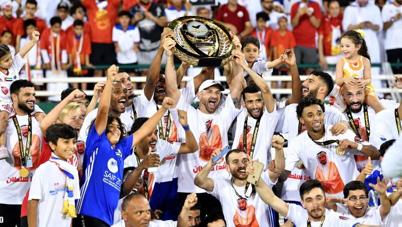 Sharjah's players and officials celebrate with their families winning the Arabian Gulf League title. Image courtesy of AGL