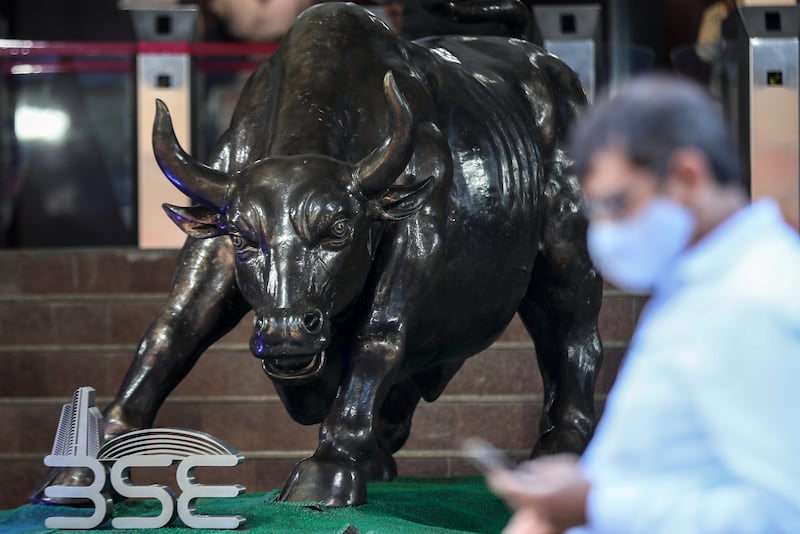 A man walks past the bronze statue of a bull at the Bombay Stock Exchange (BSE) building, in Mumbai. Indian socks are bucking the global trend this year. EPA