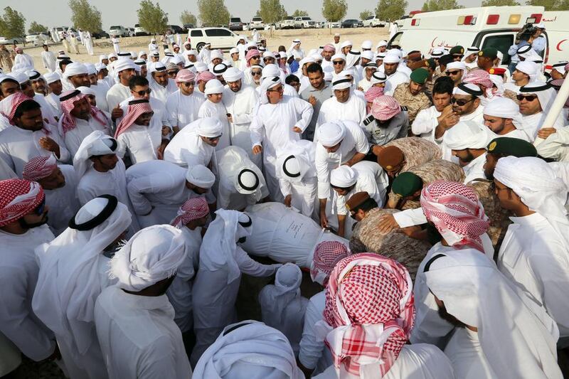 Emiratis bury Mohammed Hussein Ali Al Hosani, an Emirati soldier who was killed in Yemen’s eastern province of Marib, at Bani Yas cemetery in Abu Dhabi. AFP Photo
