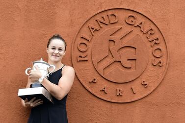 Austrlia's Ashleigh Barty poses with the French Open trophy. She defeated Marketa Vondrousova of the Czech Republic in Saturday's women's final at Roland Garros. EPA