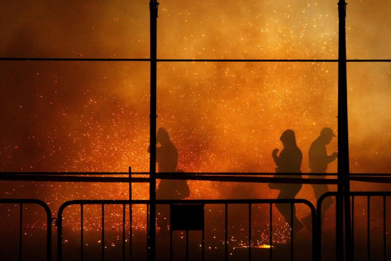 People enjoy the firework show during the traditional Nit de L' Alba in Elche, eastern Spain. Manuel/EPA