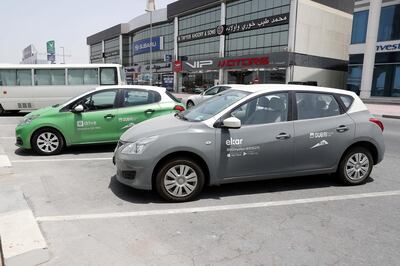 DUBAI , UNITED ARAB EMIRATES , AUG 20  – 2017 :- Cars of UDrive and EKar short term rental car services parked near the Sheikh Zayed Road in Dubai. ( Pawan Singh / The National ) Story by Adam Workman
