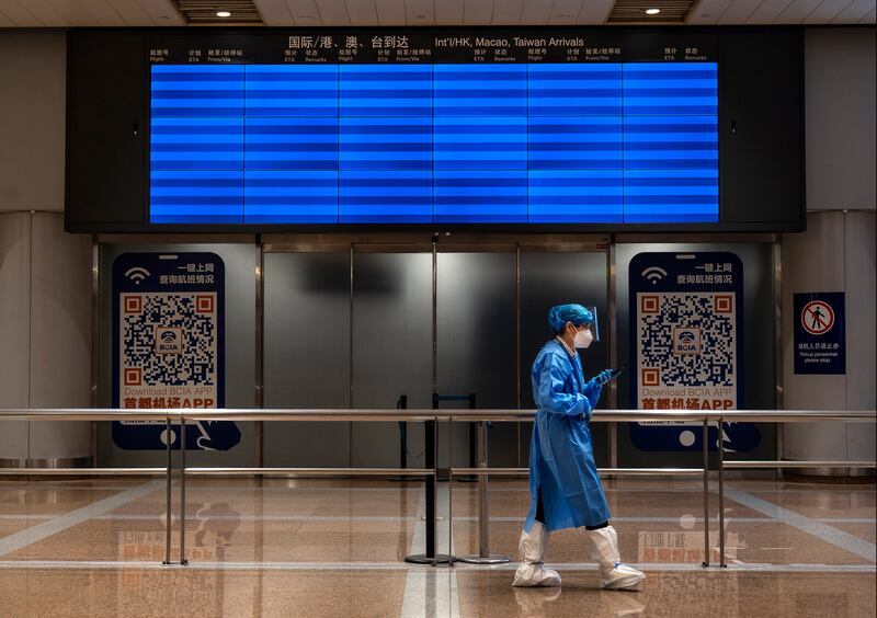 An empty screen displaying no flights in the international arrivals area of Beijing Capital International Airport. Getty Images