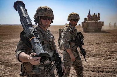 US soldiers during a joint military exercise between forces of the US-led coalition against ISIS and members of the Syrian Democratic Forces in the countryside near the Syrian town of Al Malikiya, September, 2022. AFP