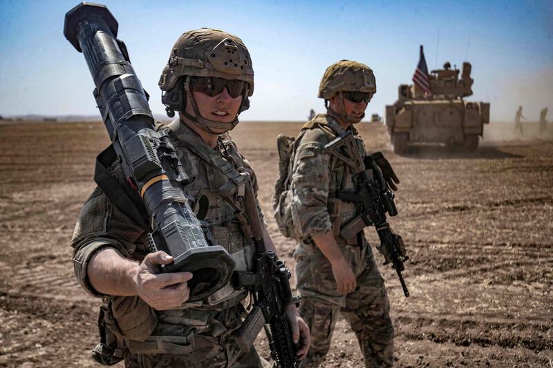 US soldiers on patrol in Syria. A drone strike in the north of the country killed a suspected ISIS member on Monday, a war monitor said. AFP