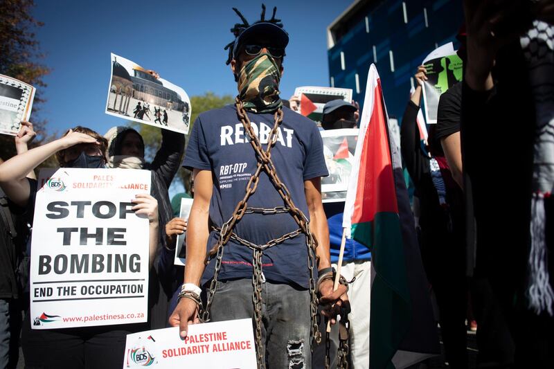 Some of the hundreds of protesters supporting the South African Boycott, Divestment and Sanctions movement demonstrate outside the Israel Trade Mission against recent attacks by Israel on the Gaza Strip, in Johannesburg. EPA