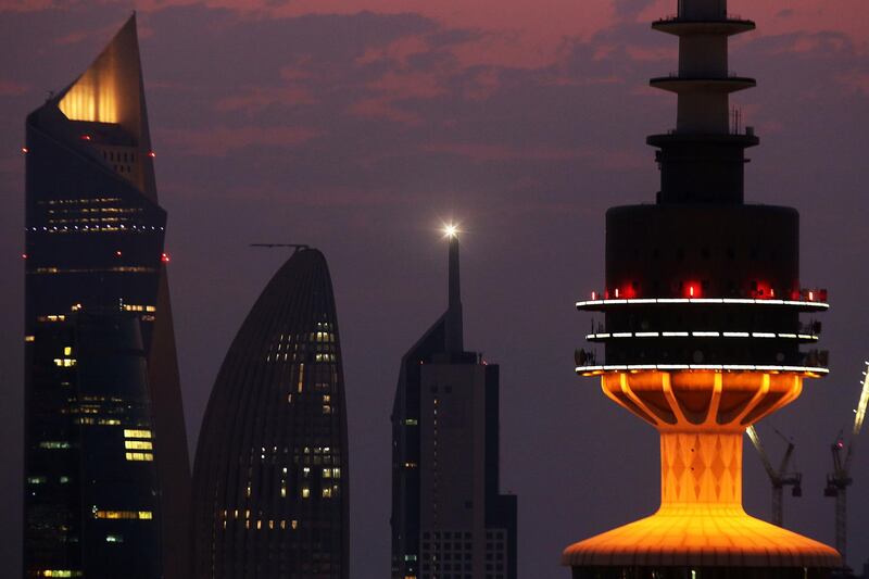The tops of Liberation, Al-Raya, NBK and Al-Hamra towers in Kuwait City at sunrise. AFP