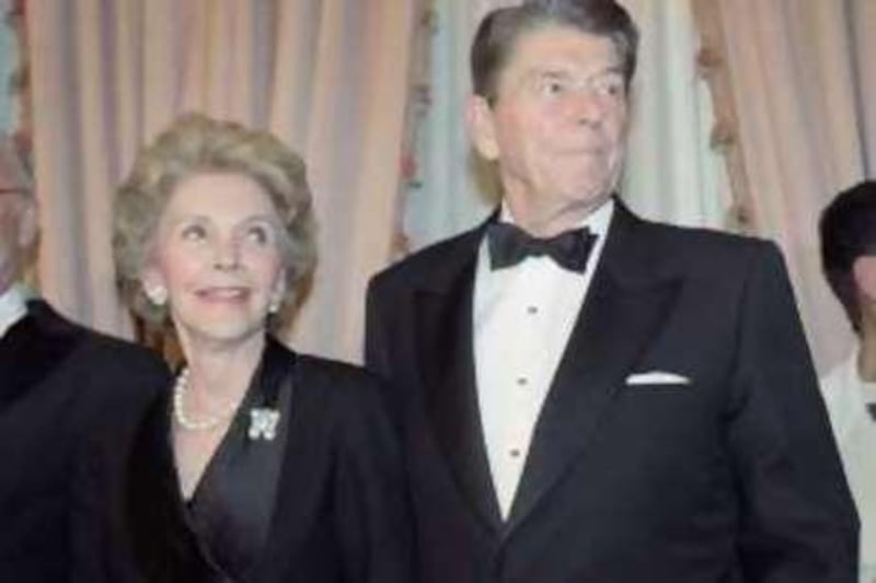 Former President Ronald Reagan and his wife Nancy pose for pictures on Tuesday, March 26, 1991 in New York. They were attemding the "1991 National Sales Hall of Fame" awards at the Waldorf-Astoria. (AP Photo/Bebeto Matthews)