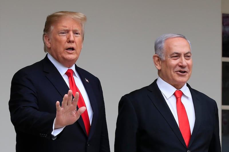 FILE - In this March 25, 2019, file photo, President Donald Trump welcomes visiting Israeli Prime Minister Benjamin Netanyahu to the White House in Washington. A blueprint the White House is rolling out to resolve the decades-long conflict between the Israelis and Palestinians is as much about politics as it is about peace. President Donald Trump said he would likely release his long-awaited Mideast peace plan a little before he meets Tuesday with Israeli Prime Minister Benjamin Netanyahu and his main political rival Benny Gantz. (AP Photo/Manuel Balce Ceneta, File)
