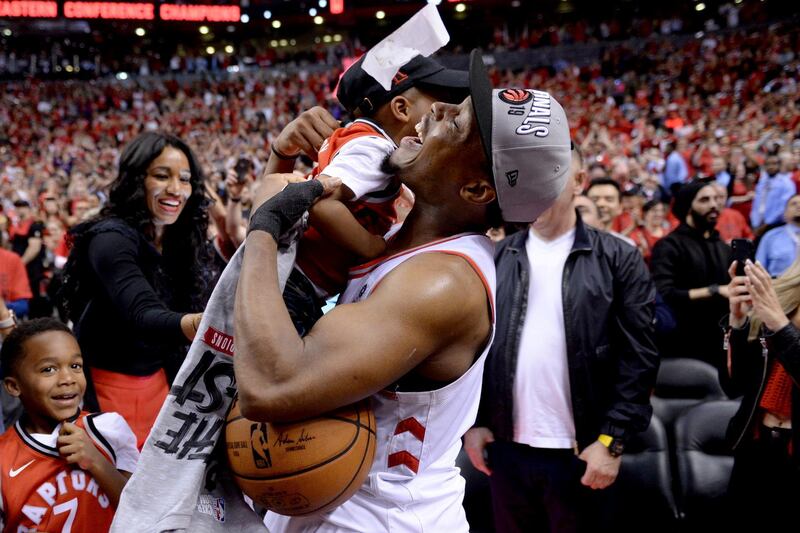 Toronto Raptors guard Kyle Lowry celebrates with one of his children. AP Photo