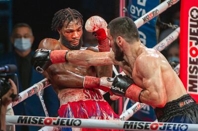 Artur Beterbiev, right, knocks out Marcus Browne to defend his WBC and IBF light-heavyweight titles. AP