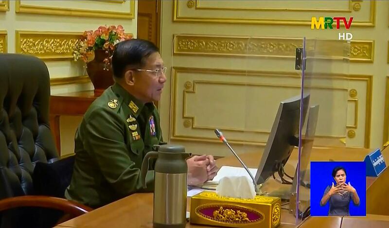 CORRECTION / This screengrab provided via AFPTV and taken from a broadcast by Myanmar Radio and Television (MRTV) in Myanmar on February 2, 2021 shows military chief General Min Aung Hlaing chairing the first cabinet meeting at the Presidential Palace in Naypyidaw, following a coup on Monday that saw de facto leader Aung San Suu Kyi detained.  - -----EDITORS NOTE --- RESTRICTED TO EDITORIAL USE - MANDATORY CREDIT "AFP PHOTO / Myanmar Radio and Television via AFPTV" - NO MARKETING - NO ADVERTISING CAMPAIGNS - DISTRIBUTED AS A SERVICE TO CLIENTS
 / AFP / AFPTV / Myanmar Radio and Television / Handout / -----EDITORS NOTE --- RESTRICTED TO EDITORIAL USE - MANDATORY CREDIT "AFP PHOTO / Myanmar Radio and Television via AFPTV" - NO MARKETING - NO ADVERTISING CAMPAIGNS - DISTRIBUTED AS A SERVICE TO CLIENTS
