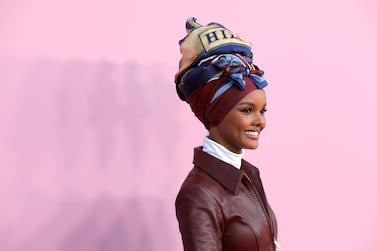Model Halima Aden is part of a project that is upcycling fabrics to create these hijab and face mask sets. Reuters