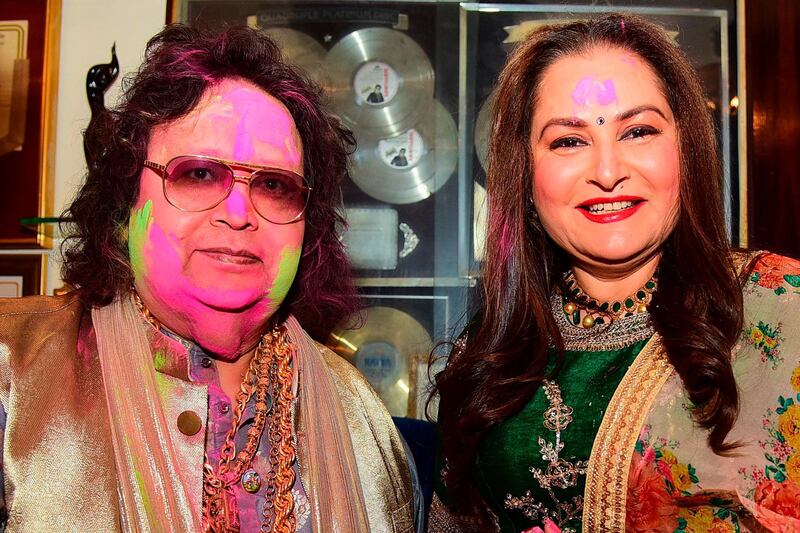 In this picture taken on March 9, 2020, Bollywood music composer/singer Bappi Lahiri (L) and actress turned politician Jaya Prada pose as they celebrate the Holi festival in Mumbai. AFP