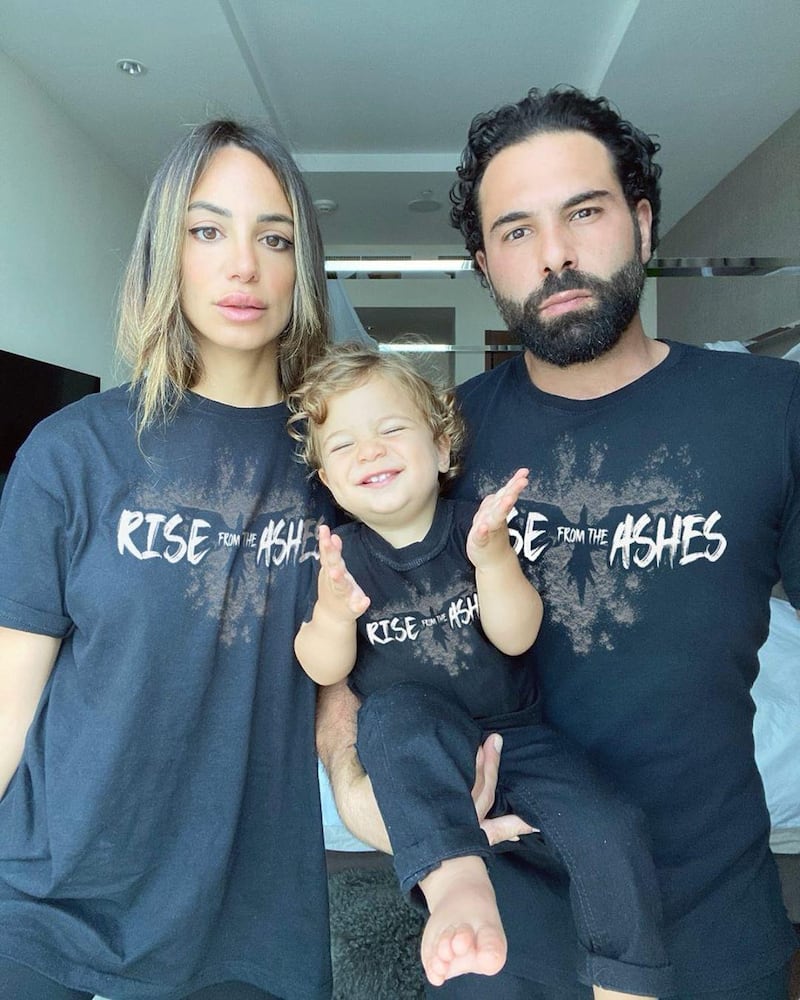 Dubai influencer Zeynab El Helw, better known as the Fashion Pirate, with husband Mohamad Kanso and son Luca, wearing Zuhair Murad's Rise from the Ashes T-shirt. Instagram / fashion_pirate