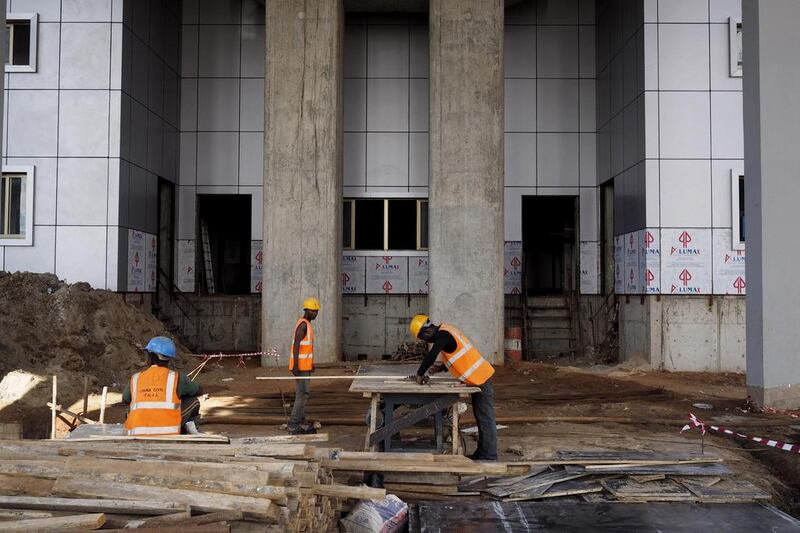 A man works at the National Arts Theatre stop of the Blue Line of the light rail system under construction by China Civil Engineering Construction Corporation. Joe Penney / Reuters