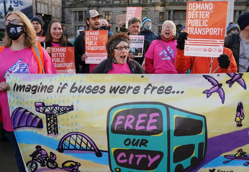 Campaigners from Friends of the Earth Scotland, Get Glasgow Moving and the International Transport Workers Federation gather in George Square, Glasgow, demanding better public transport as an essential part of addressing climate change during the Cop26 summit in the city. PA