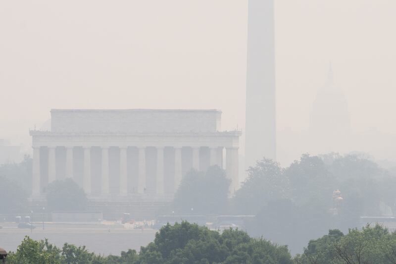 The Lincoln Memorial and Washington Monument in Washington are shrouded in haze. AFP