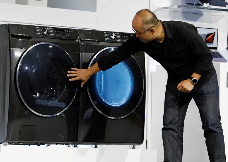 Yoon Lee, senior vice president, Samsung Electronics America, looks at a new front-load washer. AP Photo