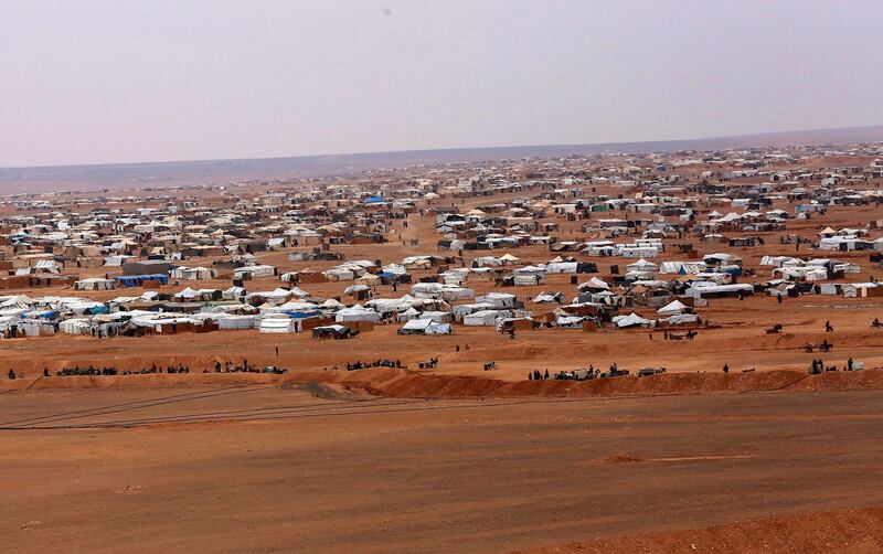 FILE - This file picture taken Tuesday, Feb. 14, 2017, shows an overview of the informal Rukban camp, between the Jordan and Syria borders. The United Nationsâ€™ children agency says on Wednesday, Oct. 10, 2018 that two children have died in a desert camp for displaced people along the Syria-Jordan border. The agency says a 5-day-old boy and a 4-month-old girl died in the squalid Rukban camp, which houses over 40,000 people. (AP Photo/ Raad Adayleh, File)