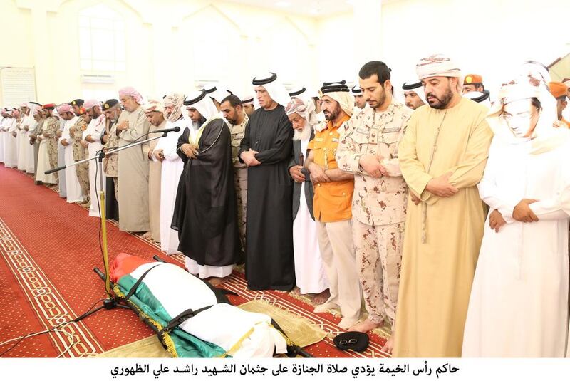 Sheikh Saud bin Saqr Al Qasimi, Ruler of Ras Al Khaimah, prays over the body of WO Rashid Ali Mohammed Al Duhouri. Wam