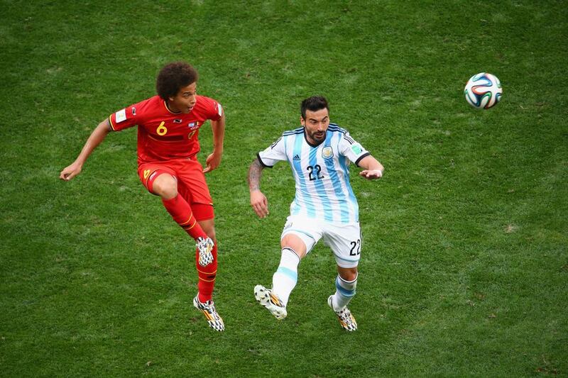 Axel Witsel of Belgium and Ezequiel Lavezzi of Argentina compete for the ball during their match on Saturday at the 2014 World Cup in Brasilia, Brazil. Jamie Squire / Getty Images