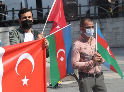 Turkish demonstrators participate in a demonstration in support of Azerbaijan against Armenia in Ankara on October 1, 2020.
 Heavy shelling between Armenian and Azerbaijani forces persisted on October 1, 2020 despite fresh calls from world leaders for an end to days of fighting over the disputed Nagorny Karabakh region. The rival Caucasus nations have been locked in a bitter stalemate over the Karabakh region since the collapse of the Soviet Union when the ethnic Armenian province broke away from Azerbaijan. / AFP / Adem ALTAN
