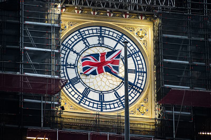 A union flag flies in front of the clock face of Big Ben just after the sun rises on January 1, 2021, the first day of the UK's future outside the European Union. Getty Images