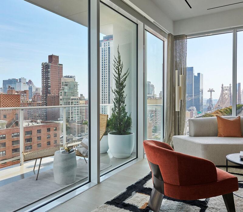 Add chaise lounges, dining sets or planters to create a more inviting outdoor space, and set up a comfy seating area by a window with great lighting. Photo: 200 East 59th Street