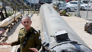 Israeli military spokesman Rear Admiral Daniel Hagari, at Julis military base, in southern Israel, with what they say is an Iranian ballistic missile retrieved from the Dead Sea after Iran launched drones and missiles at Israel. Reuters