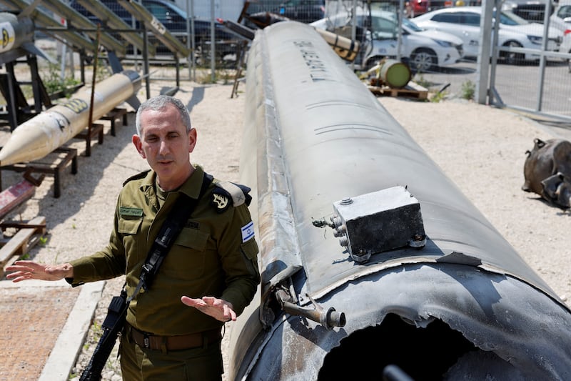 Israeli military spokesman Rear Admiral Daniel Hagari, at Julis military base, in southern Israel, with what they say is an Iranian ballistic missile retrieved from the Dead Sea after Iran launched drones and missiles at Israel. Reuters