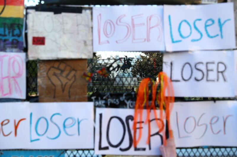 A view of the White House through a fence with placards attached reading "Loser" after early results of the 2020 U.S. presidential election were announced, in Washington, US. Reuters