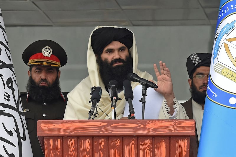 Taliban Interior Minister Sirajuddin Haqqani speaks to new Afghan police recruits during a graduation ceremony at the police academy in Kabul on March 5, 2022.  (Photo by Wakil KOHSAR  /  AFP)