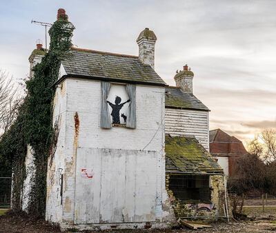 Banksy's latest artwork, on a farmhouse in Herne Bay, Kent, before being destroyed. PA