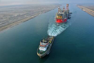 A tugboat pulls an Energean ship along Egypt's Suez Canal. Photo: AFP
