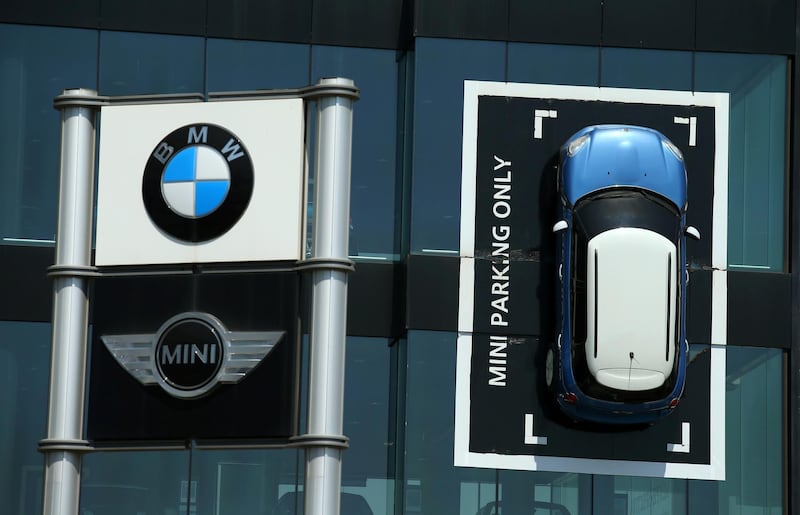 FILE PHOTO: A Mini car is fixed onto a wall at a BMW and Mini dealership in Barcelona, Spain June 2, 2017. REUTERS/Albert Gea/File Photo