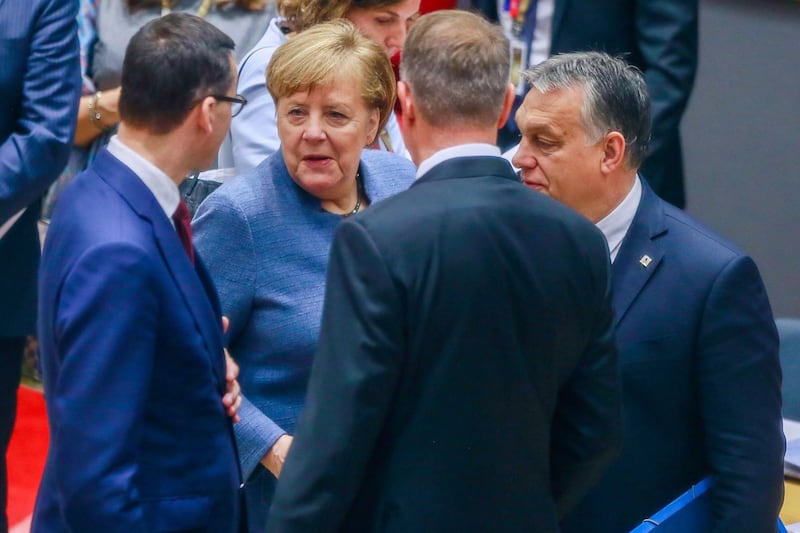 German Federal Chancellor Angela Merkel, second left, Hungarian Prime Minister Viktor Orban, right, and Poland's Prime Minister Mateusz Morawiecki, left.  AFP